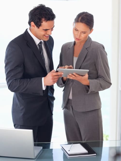 two business people consulting with laptop